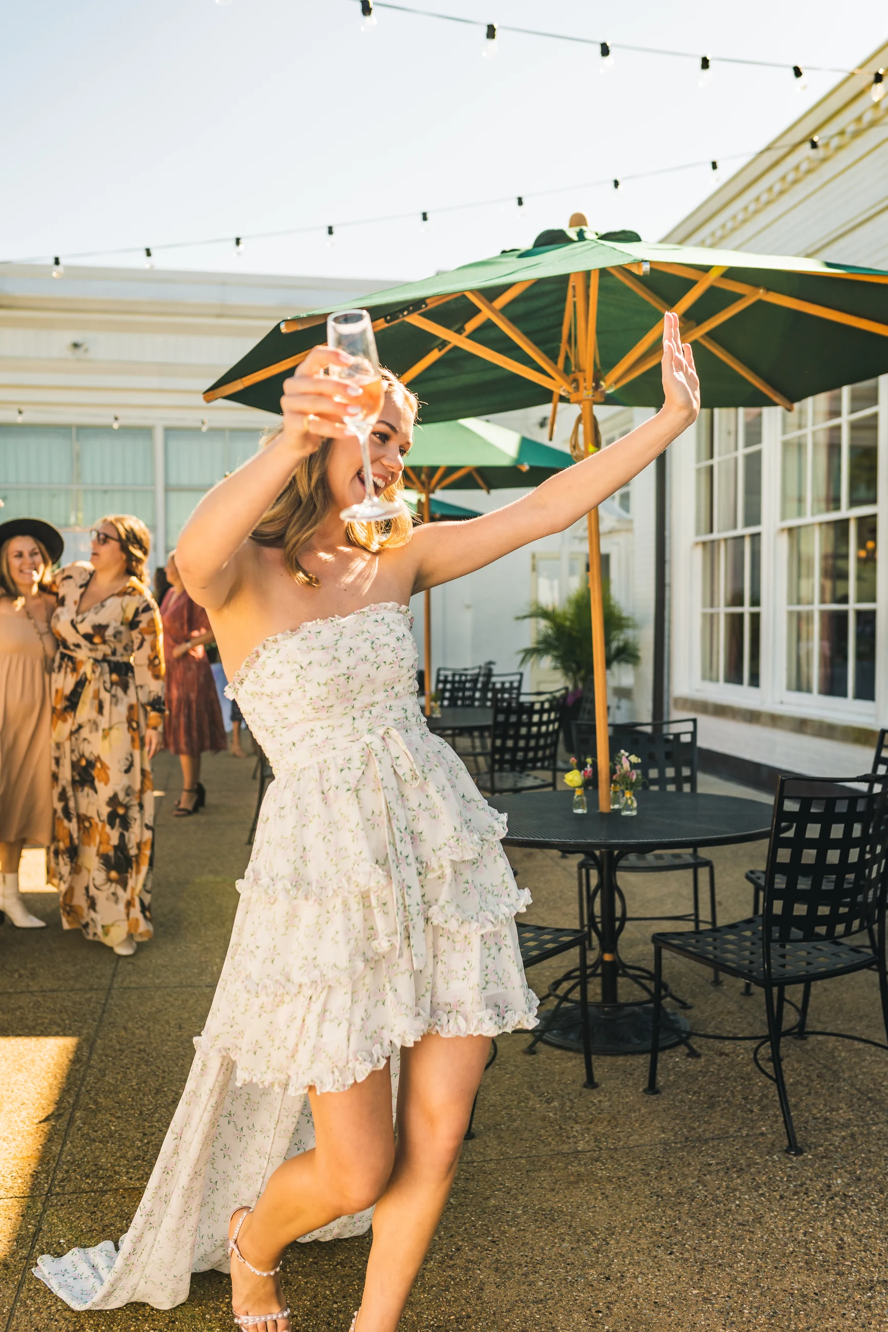 Bride celebrating with a champagne bottle