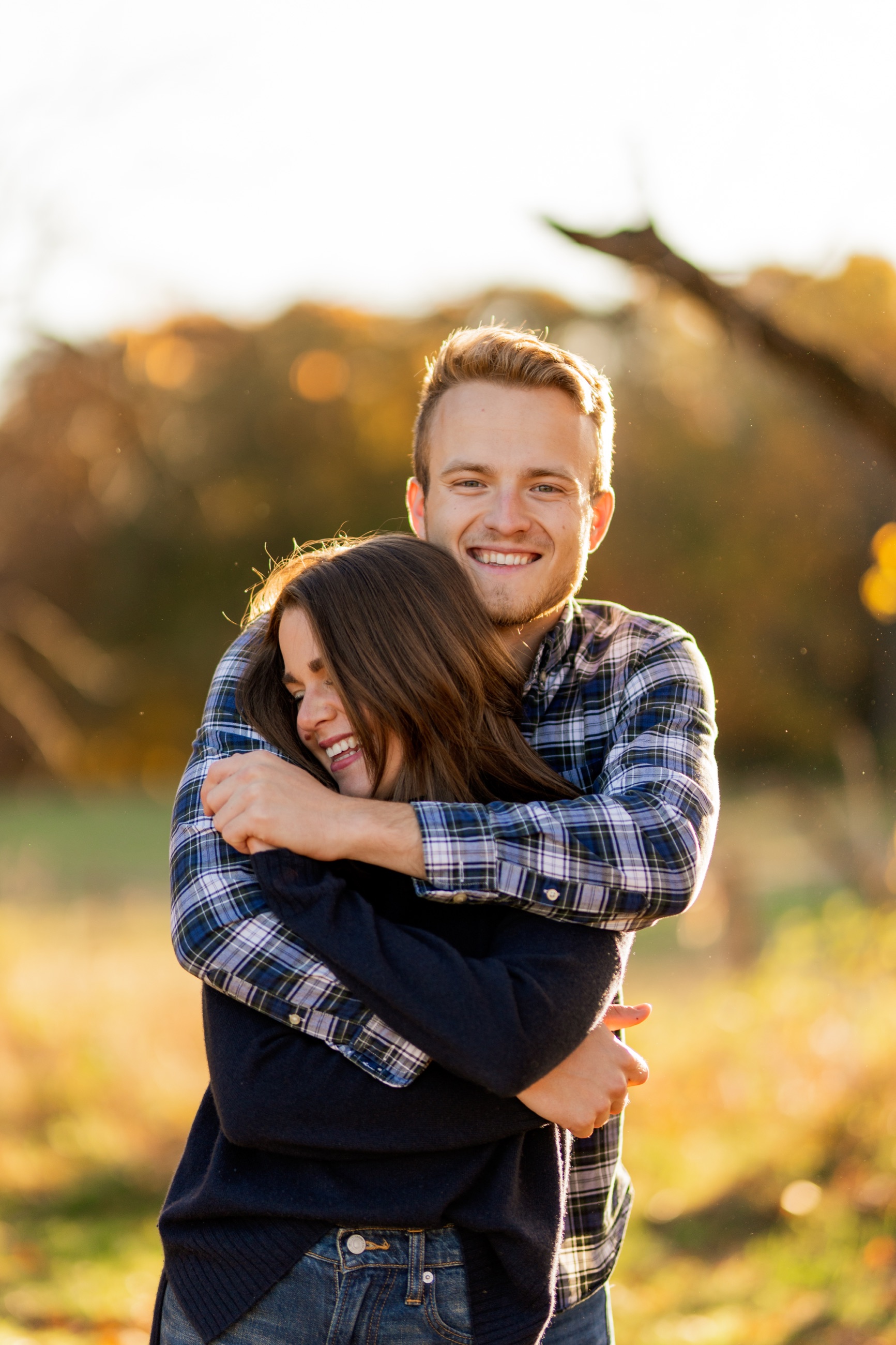 Couple laughing together in warm autumn light