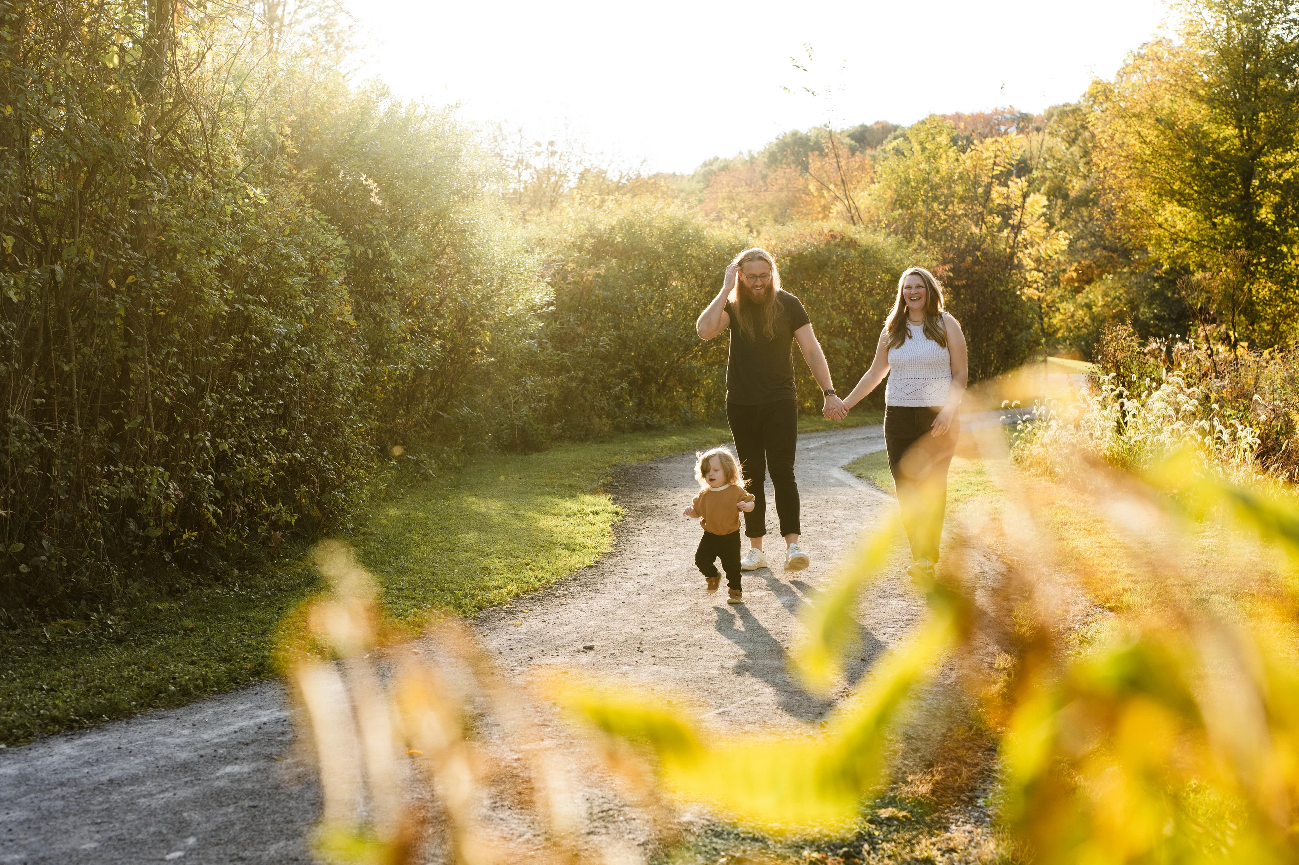 Family walking together on an autumn path
