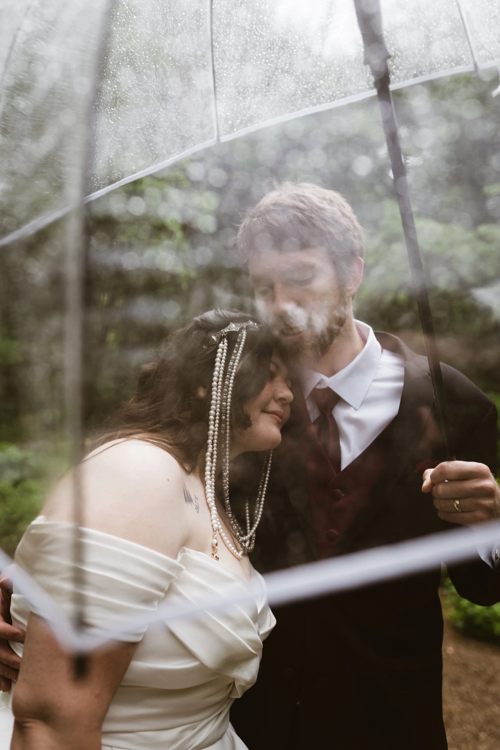 Wedding couple seen through layered reflections
